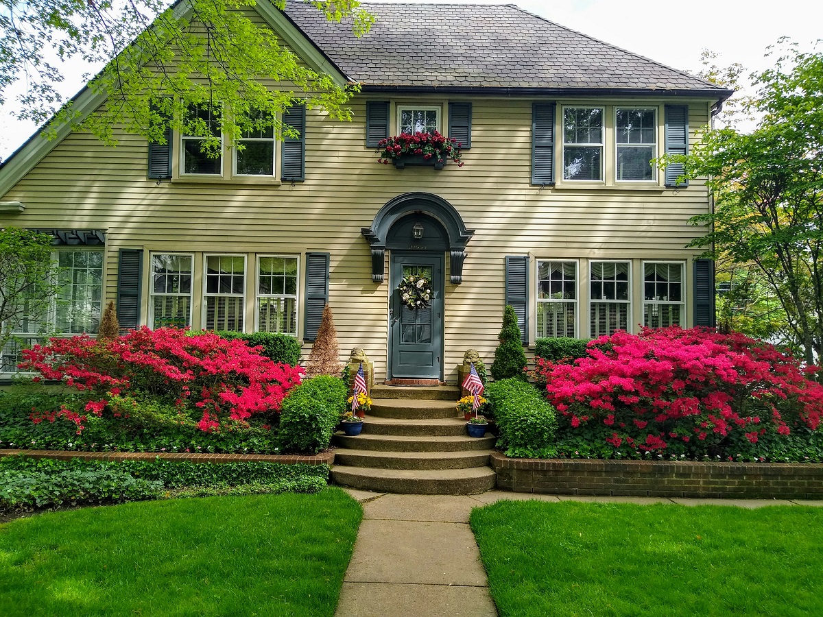 front yard with lush greenery and vibrant flowers