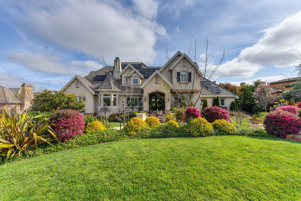 front yard with lush greenery and vibrant flowers